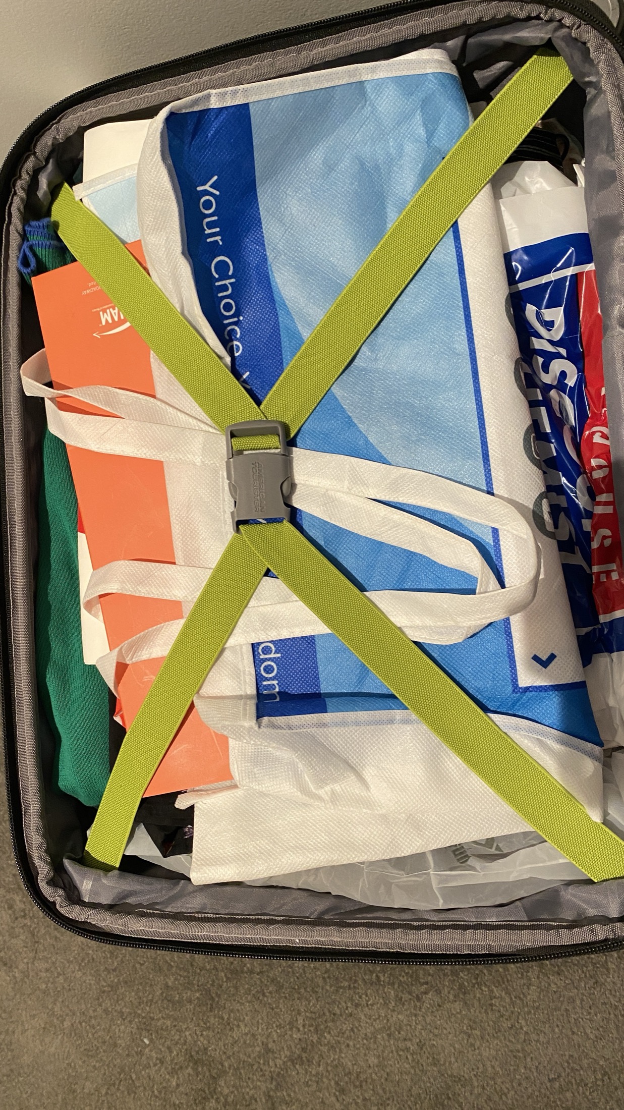Open suitcase packed for light travel
